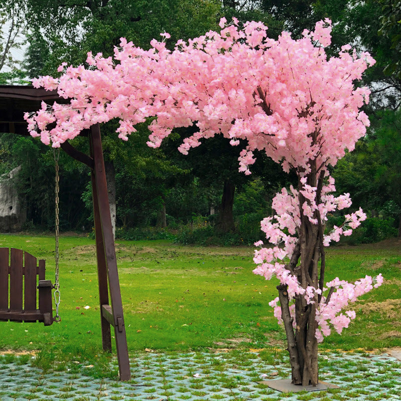 The 3m blossom tree set behind a wedding ceremony as a floral backdrop