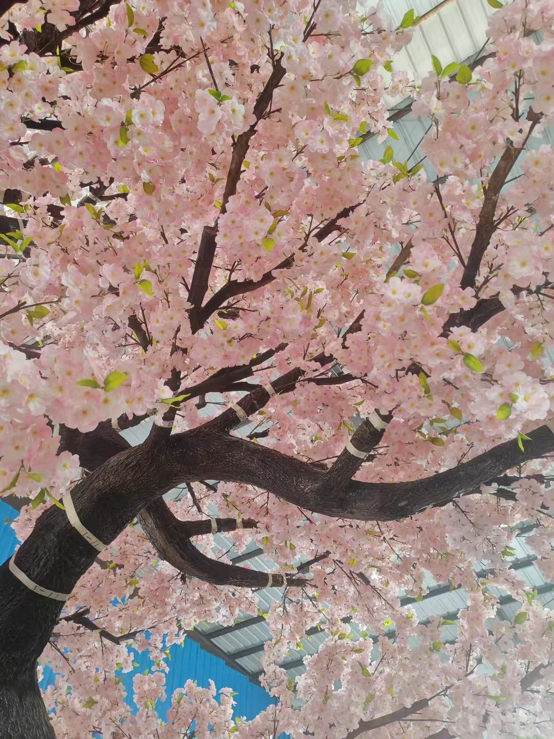The 20ft blossom tree filling an indoor atrium high above the floor below