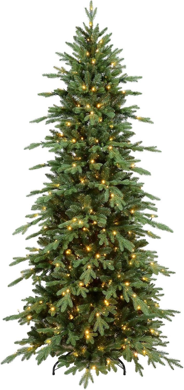 The full silhouette of the pre-lit Christmas tree against a plain wall