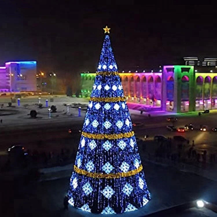 Spruce-style LED Christmas tree standing outdoors, its metal frame wrapped in pixel lights