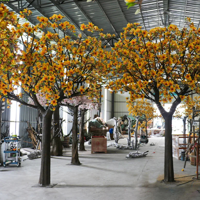Artificial magnolia tree 3.5m to 4m tall, silk blooms set on a natural wood trunk
