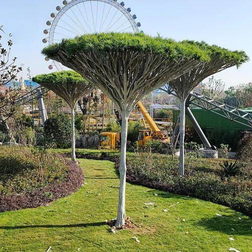 Artificial dracaena fragrans with broad arching leaves set on a fibreglass trunk