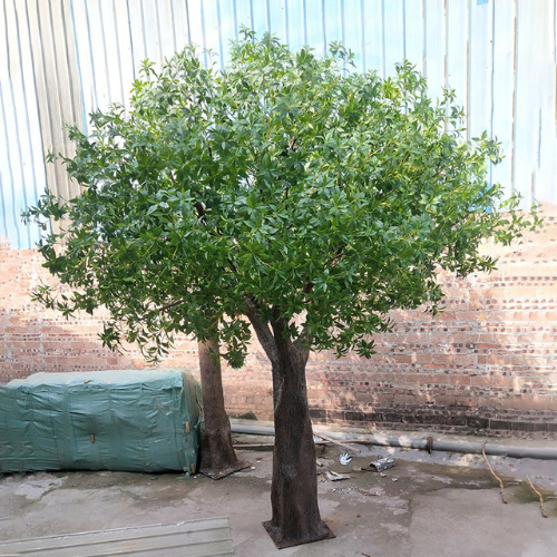 Artificial osmanthus tree with silk leaves massed across a rounded green crown