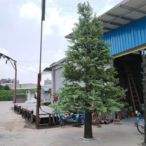 Artificial metasequoia tree, feathery conifer foliage on a tall straight trunk