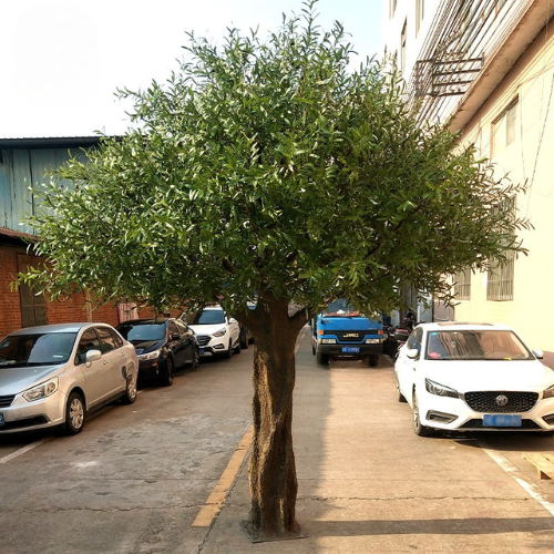 Custom artificial olive tree with silver-green foliage over a broad open crown