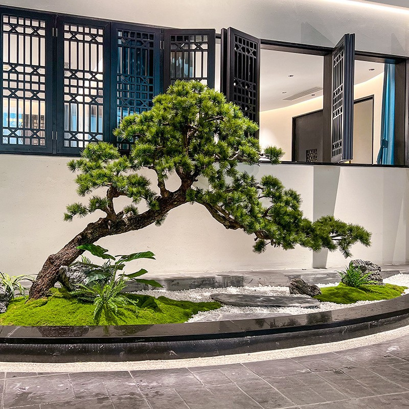 The pine tree used as indoor landscaping beside a lobby seating group