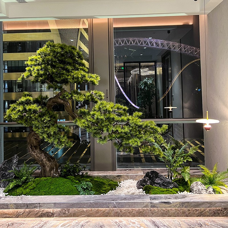 Artificial pine tree for indoor landscaping, green needles on tiered branches