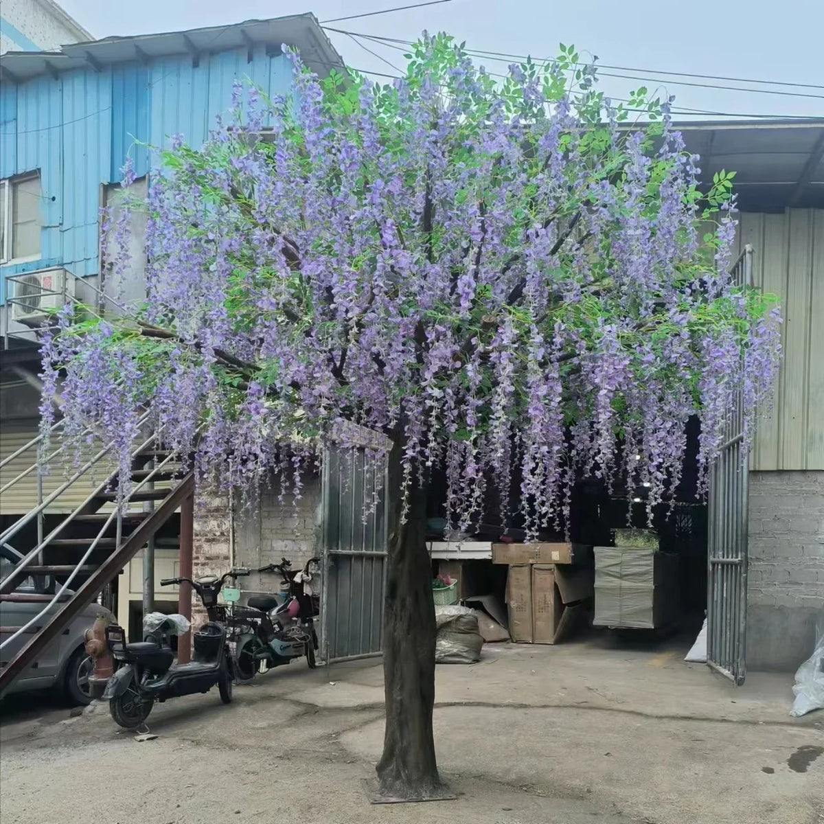 Base of the 3.5m artificial wisteria tree where it stands on the floor
