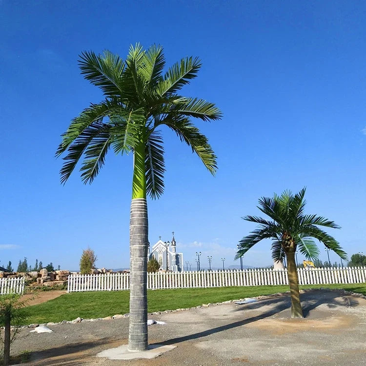 Artificial king coconut tree with UV protection, fronds arching from a tall trunk