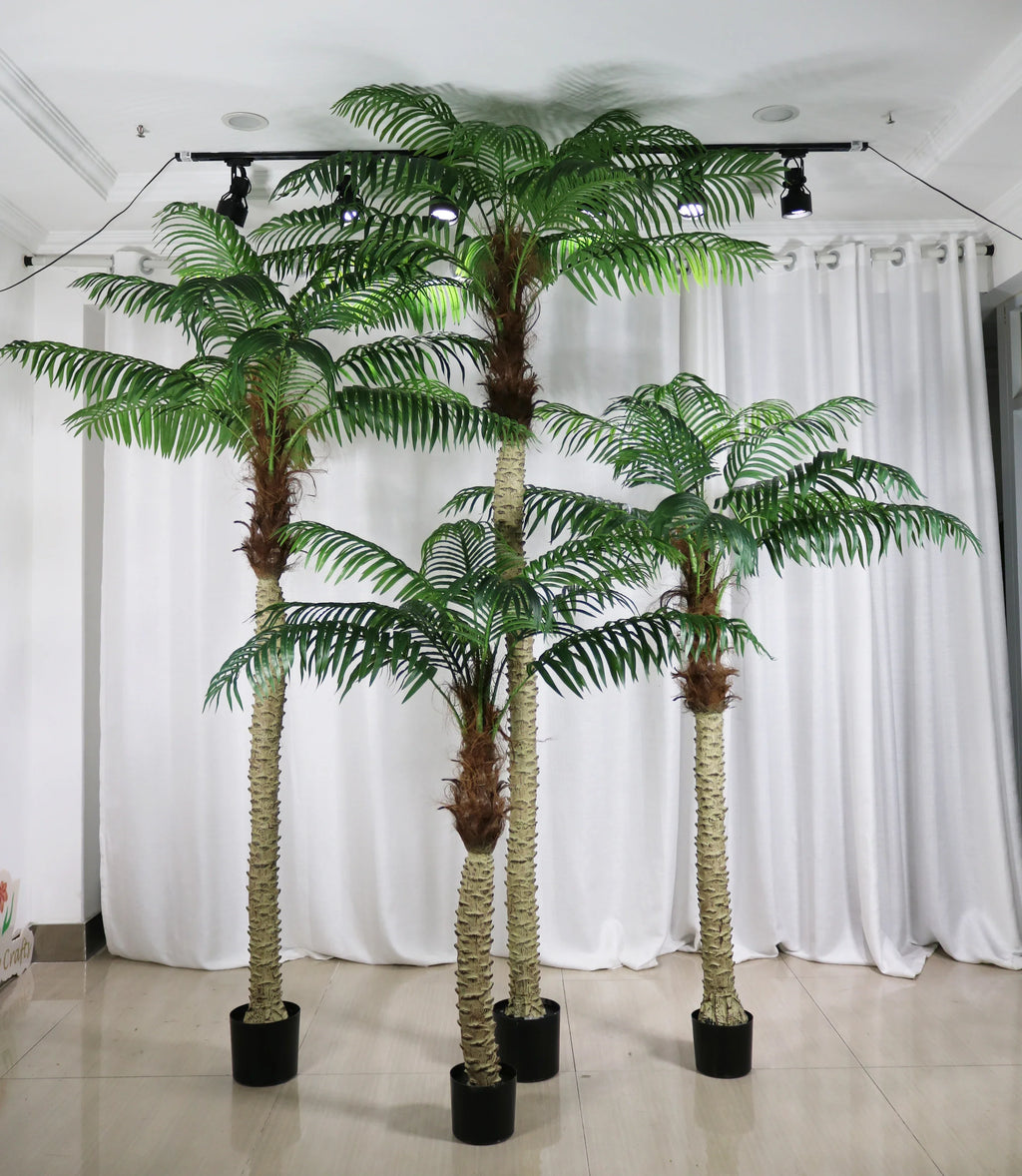 Artificial areca palm in a pot, feathered fronds arching from clustered cane stems