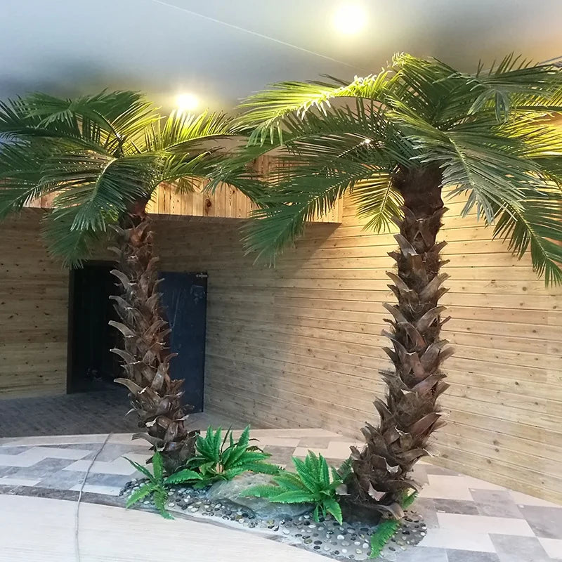 High-simulation artificial coconut tree, arching fronds above a ringed trunk