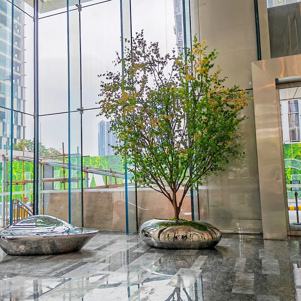 Base of the 4m decorative tree where the trunk sets into its floor planter