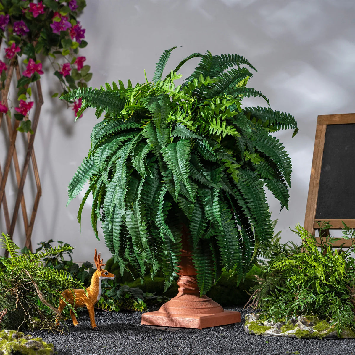 Frond tips of the Boston fern curling gently downward at their ends