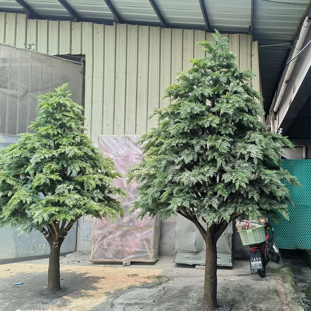 Artificial cedar tree, offered from 2.6m to 6m, with layered evergreen foliage