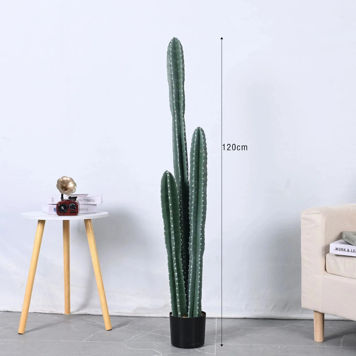 The faux cactus used as low-maintenance greenery in a home hallway corner