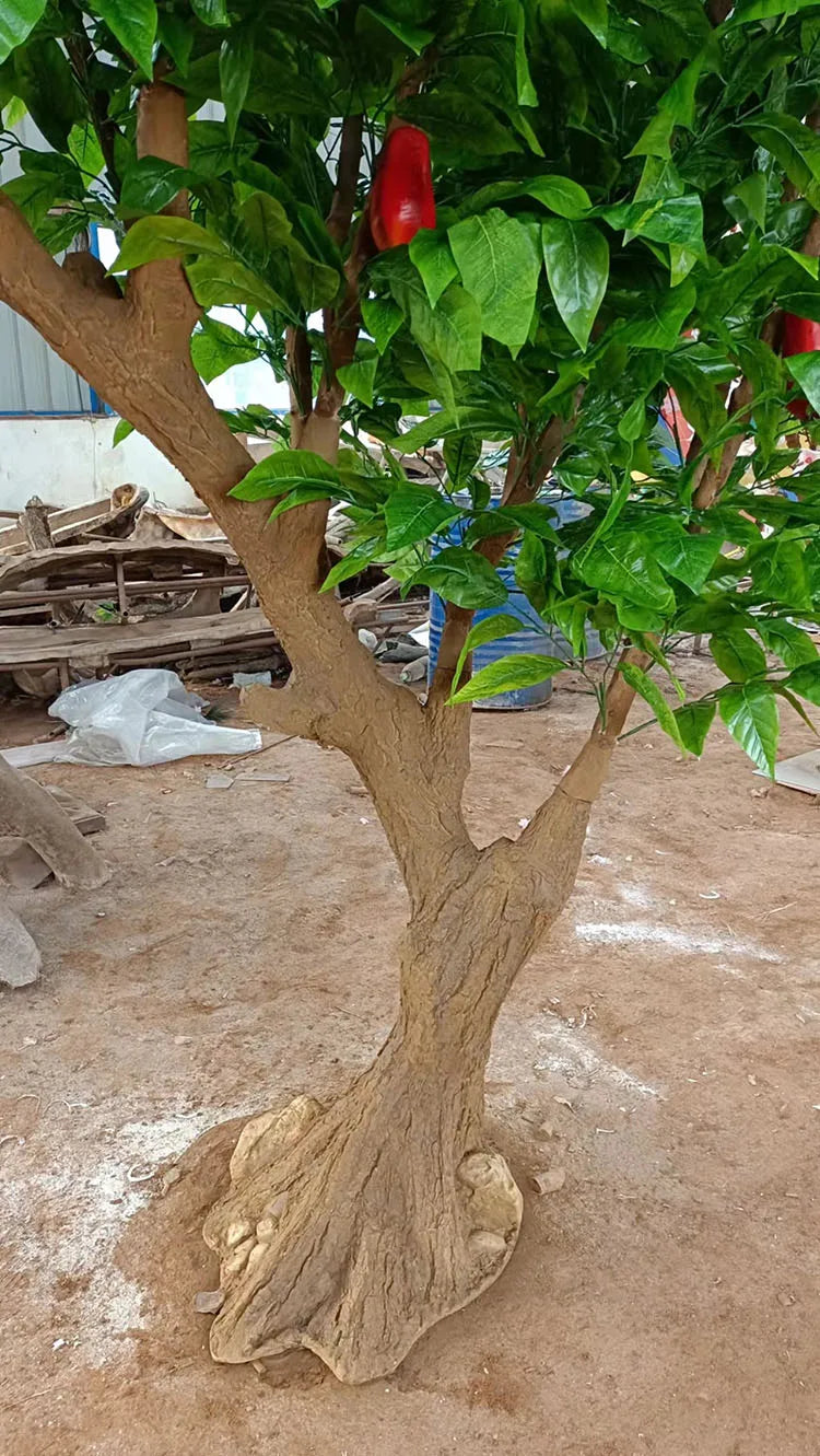 The 2.5m cocoa tree used as an indoor display beside a plain pale wall