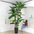 Artificial banana plant 12ft tall, very large leaves arching from a thick stem