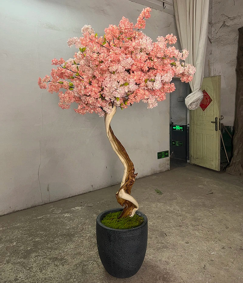 The blossom tree used indoors as an event feature beside a guest walkway