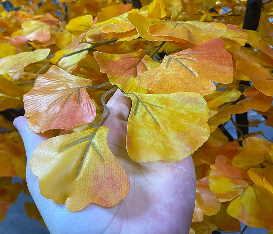 Close-up of the gold ginkgo leaves with LED lights set in among the foliage