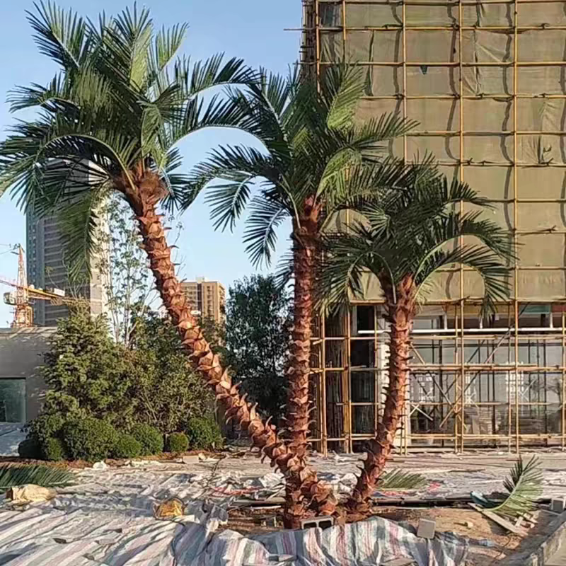 Artificial palm tree 20ft (6m) tall with a curved trunk and broad fronds at the crown
