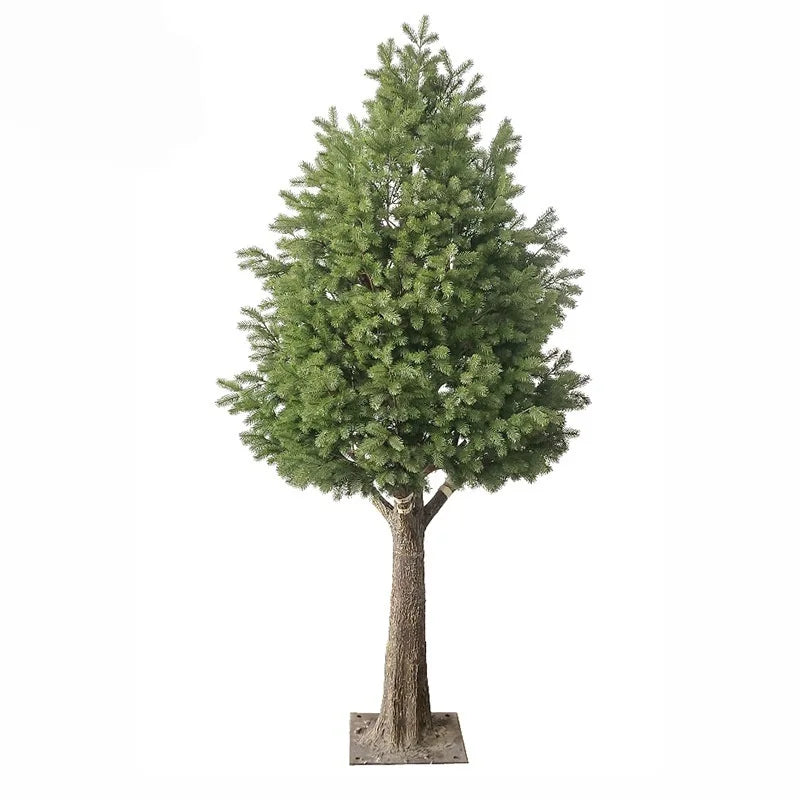 The snow-dusted pine standing in a lobby as a large indoor winter feature