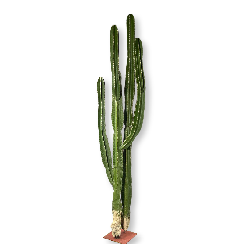 Base of the artificial cactus rising from a gravel-topped desert-style pot