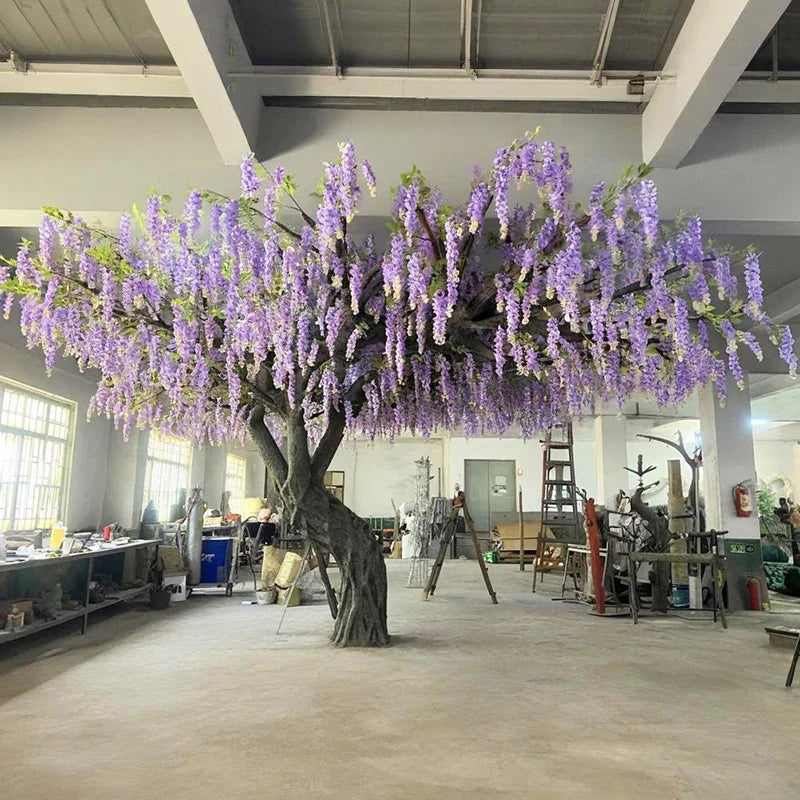 The UV-resistant wisteria planted outdoors, blooms hanging over a walkway