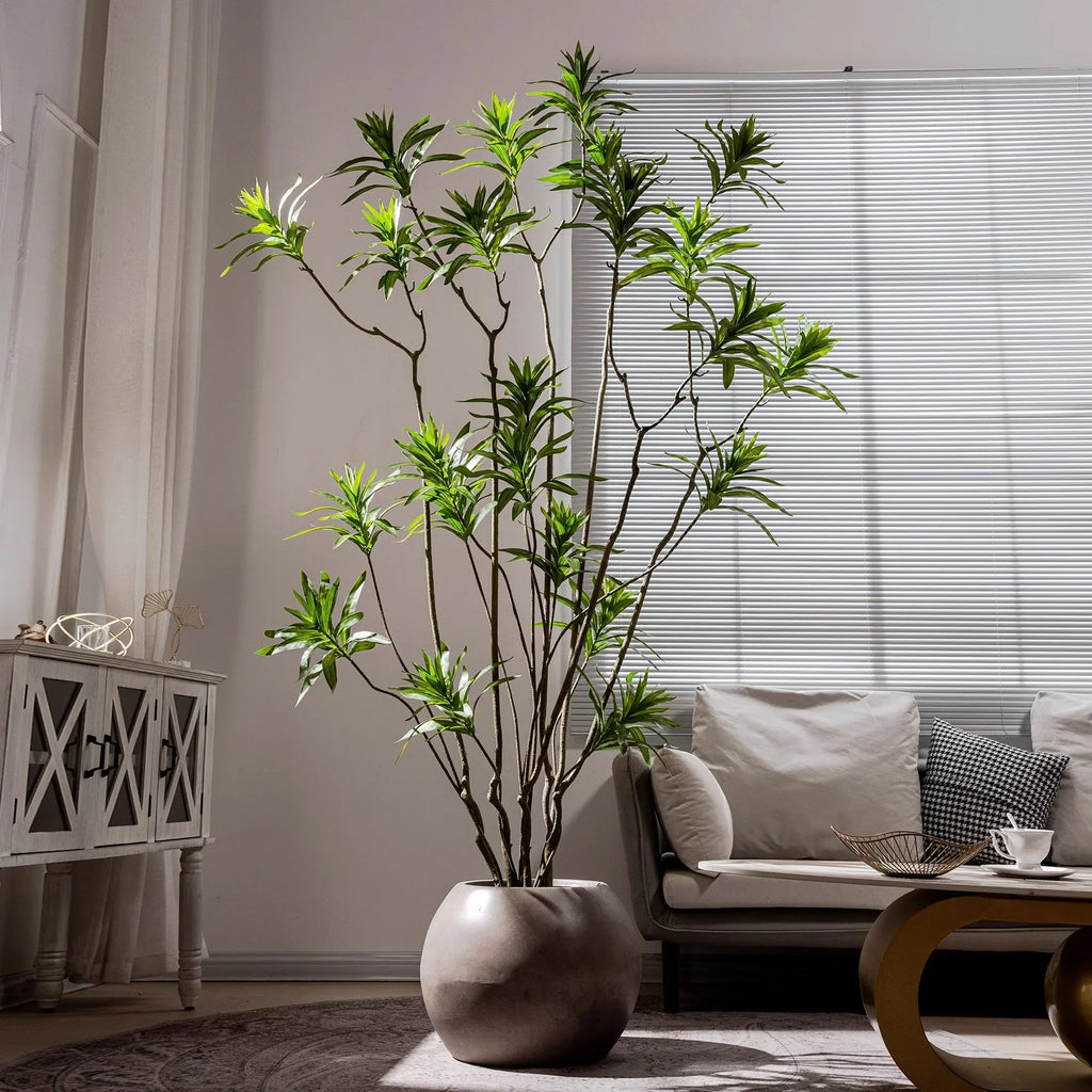 Artificial bamboo tree in a pot, slender canes carrying fine lifelike foliage