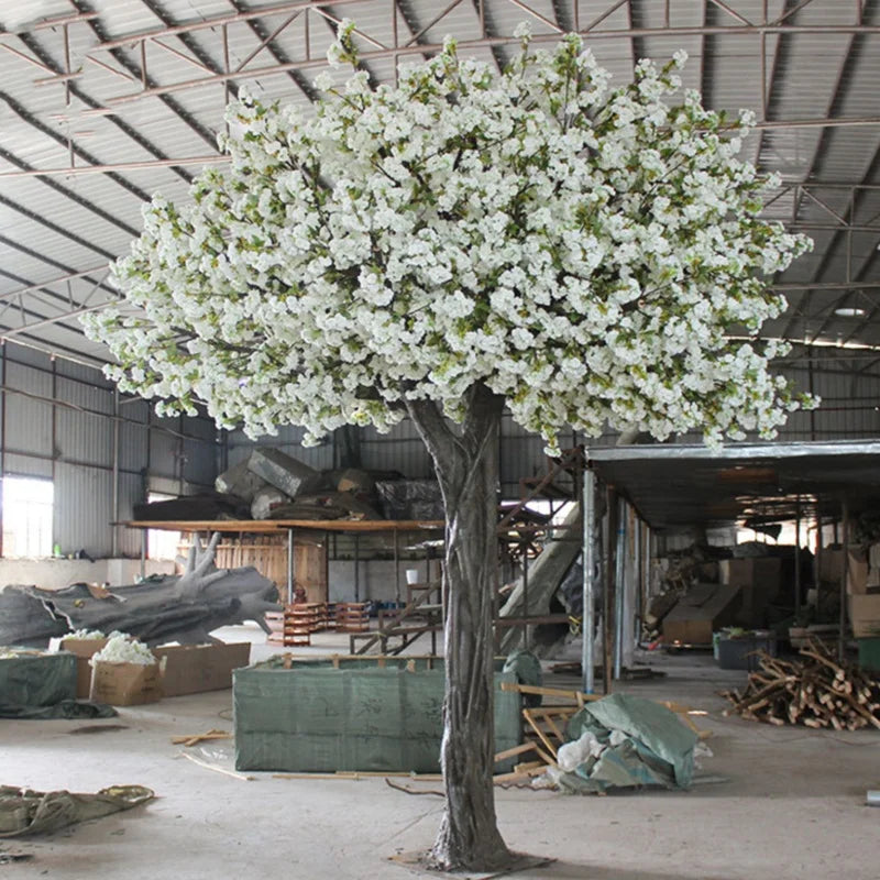 The crown of the 10ft blossom tree seen from below against the ceiling