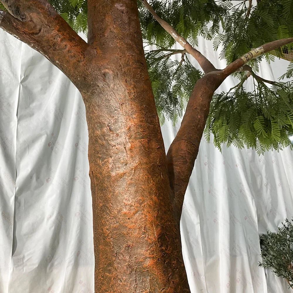 Base of the acacia tree where the fibreglass trunk sets into the ground