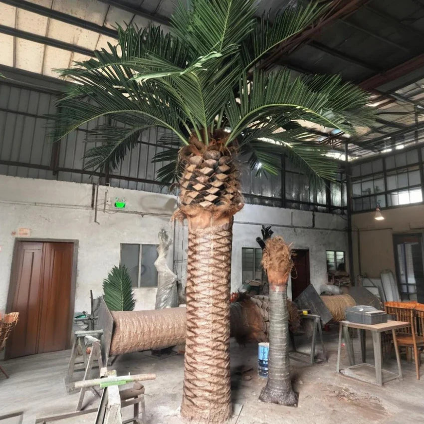 Artificial date palm 10m tall, UV resistant, fronds radiating from a fibrous trunk