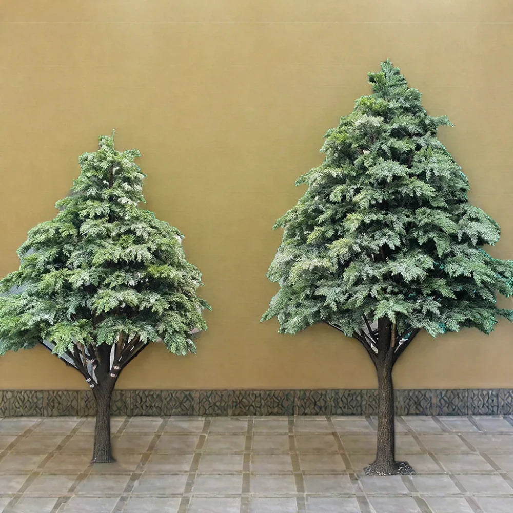 The artificial cedar tree used outdoors beside a paved garden pathway