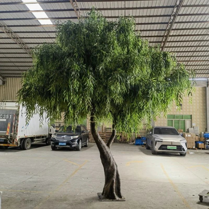 Artificial weeping willow 13ft tall, long trailing branches falling from a wide crown