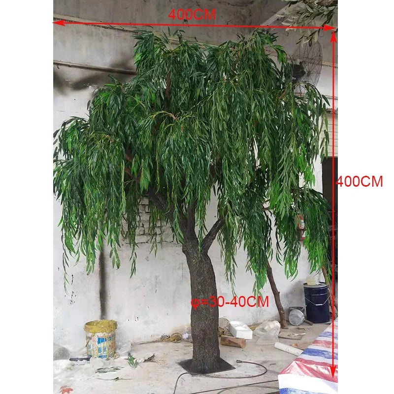 The 13ft weeping willow indoors, branches reaching down towards the floor