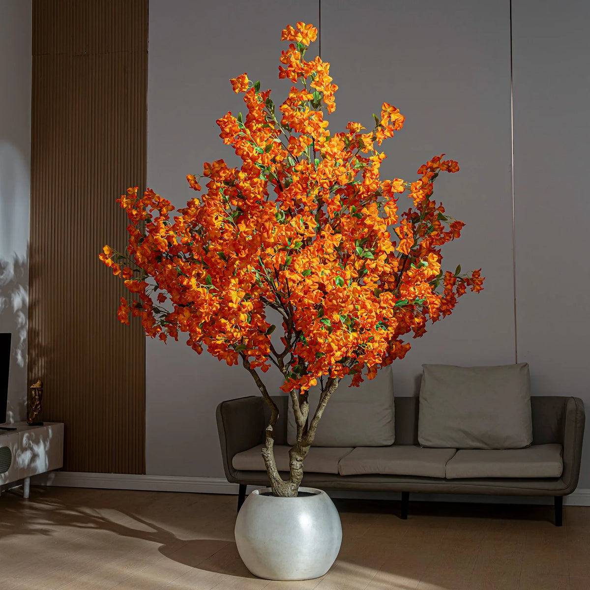 The blossom tree used as event decor behind a styled banquet table setting