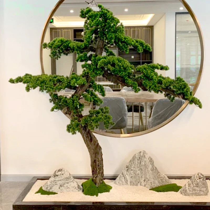 The sculpted trunk of the 6ft pine bonsai curving up from its base