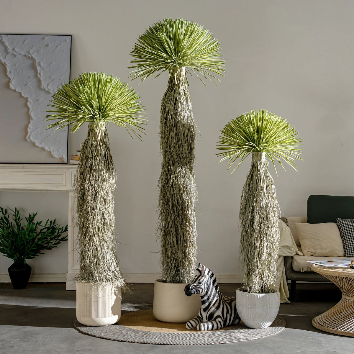 Pot and base of the artificial dracaena tree, topped with moss and bark