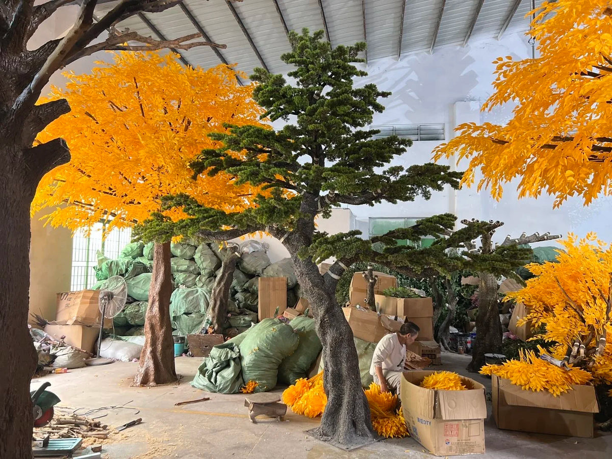 Artificial pine tree 4m tall, green needles layered over a textured fibreglass trunk