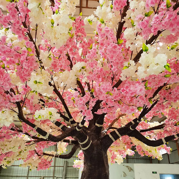 The sakura tree used as a floral backdrop at a wedding ceremony setting