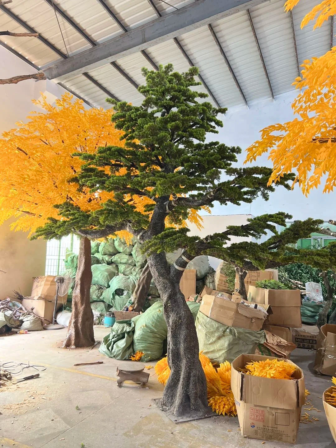 Base of the 4m artificial pine where the trunk sets into its planter
