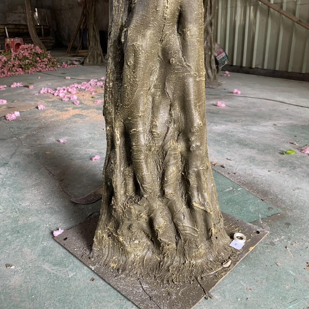 The blossom tree used as a floral feature at an outdoor wedding setting
