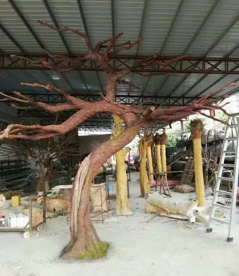 The 4m bare tree used as a sculptural backdrop piece at an indoor event