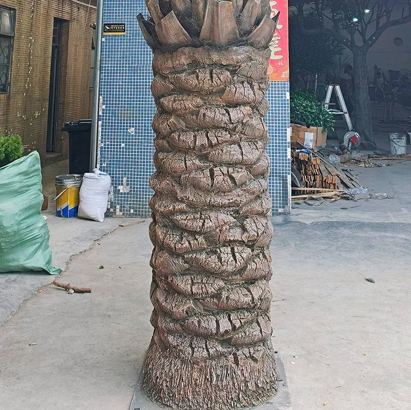The 9.8ft artificial palm beside a poolside patio as outdoor tropical greenery