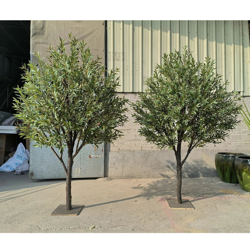 Artificial olive tree 10ft tall, with silver-green foliage on a real wood trunk