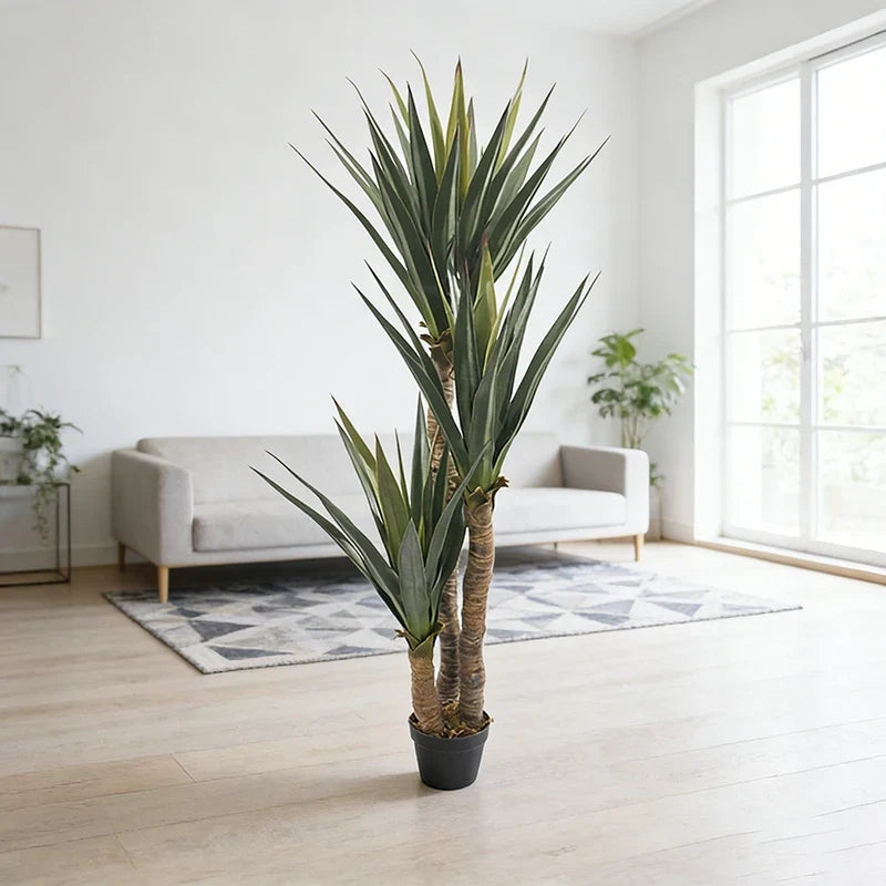 Artificial agave plant 5ft tall, thick pointed leaves fanning out from a potted base