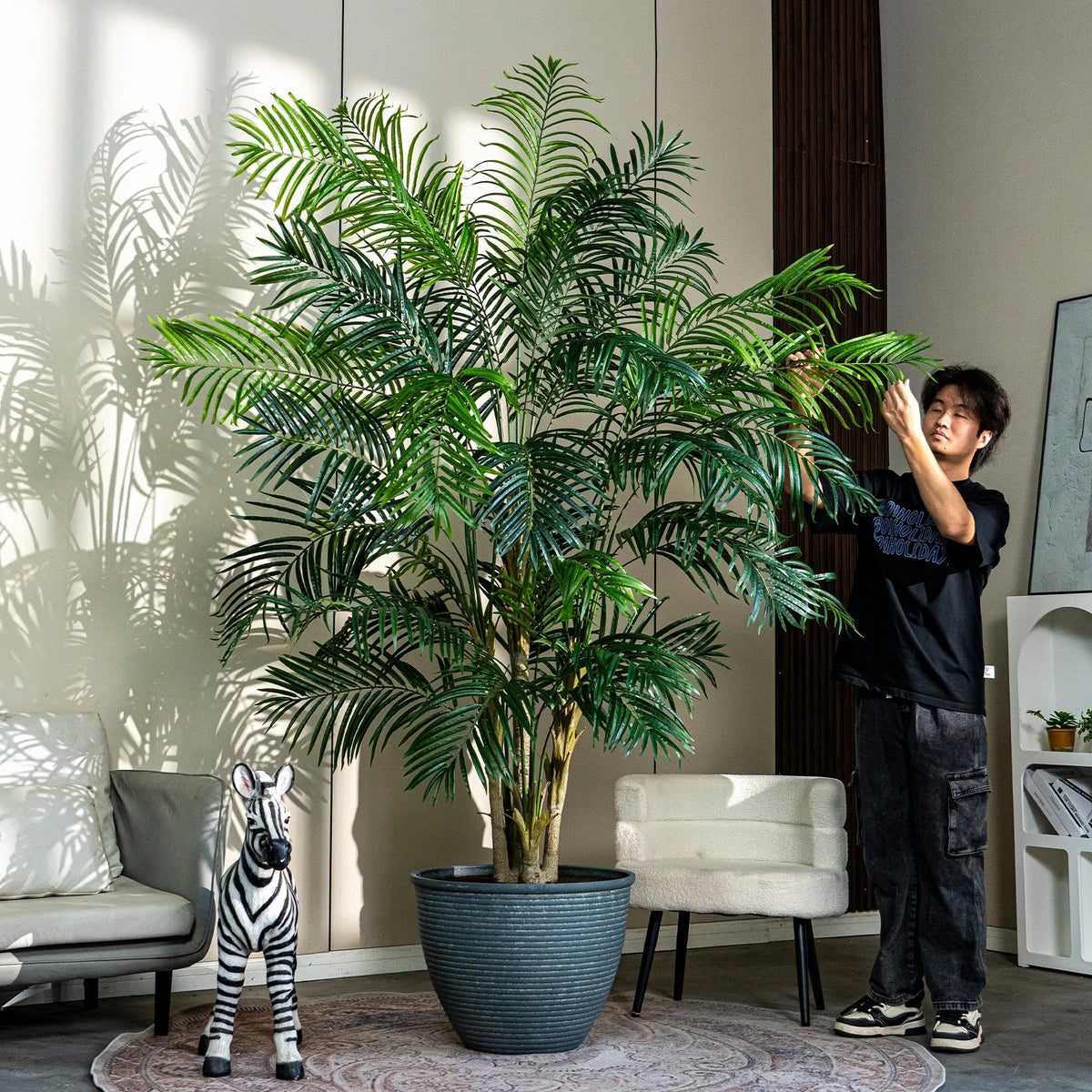 Leaf segments of the lady palm seen from above, fanning out from each stem