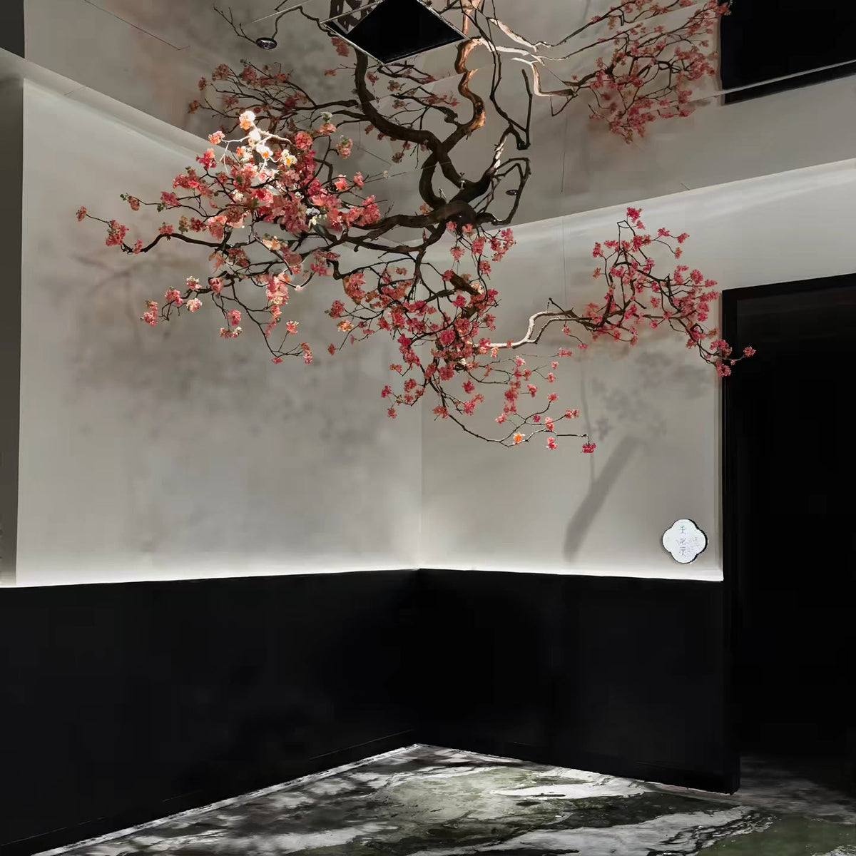 Faux flower branch 6.5ft long, hung from the ceiling with blossoms trailing down