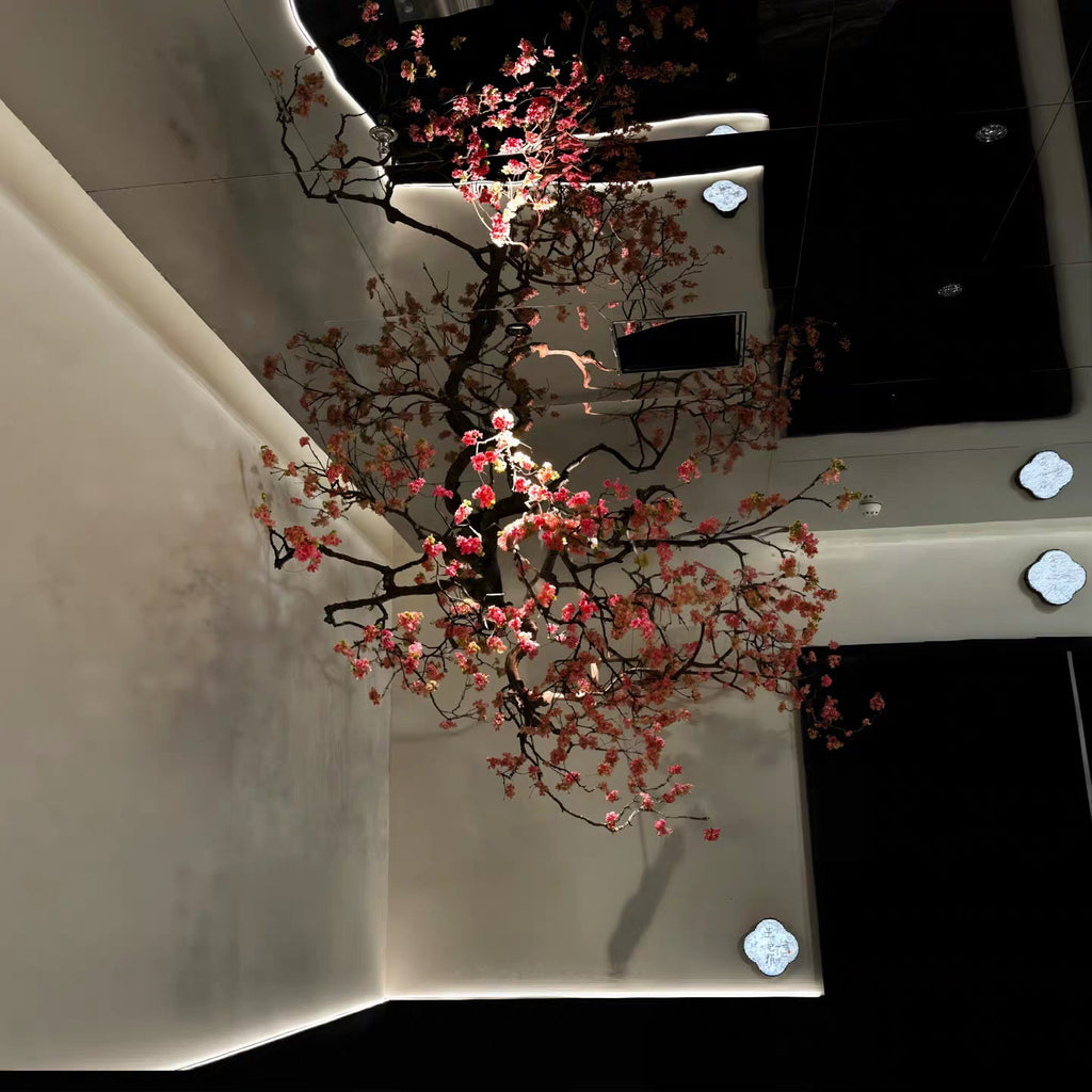 Flower branches used as a floral backdrop behind a livestream filming set