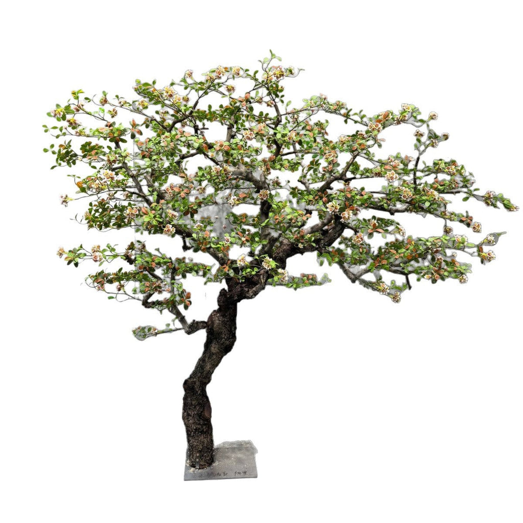 The begonia tree used in an island-style lobby display beside lounge seating