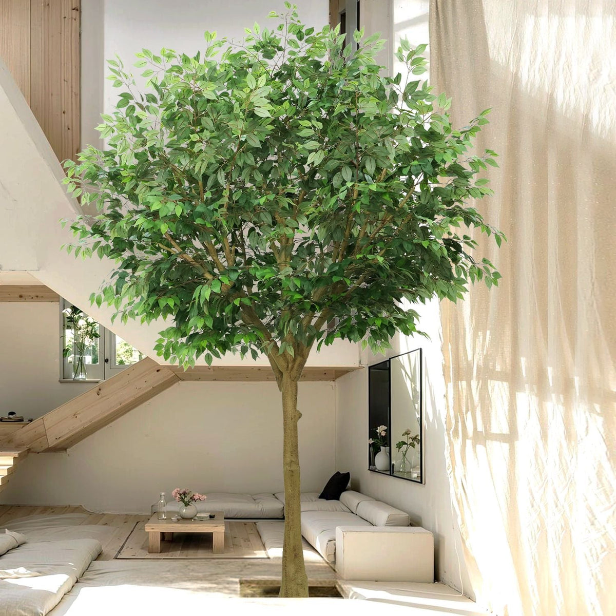 The trunk of the 9ft artificial olive tree rising from its large floor planter
